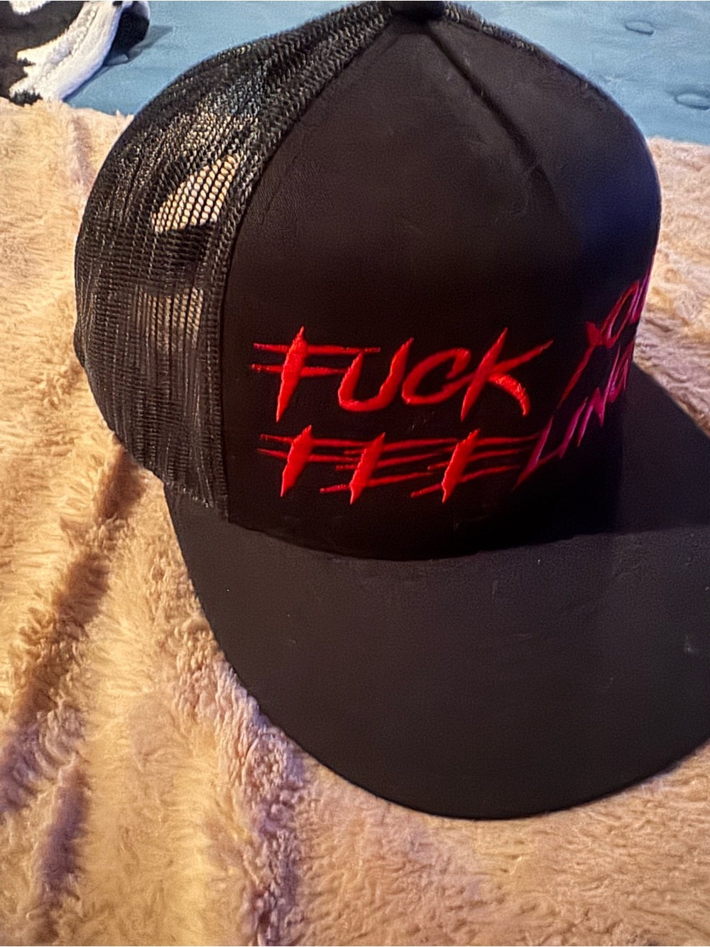 Black Trucker Cap with Red Embroidered Slogan